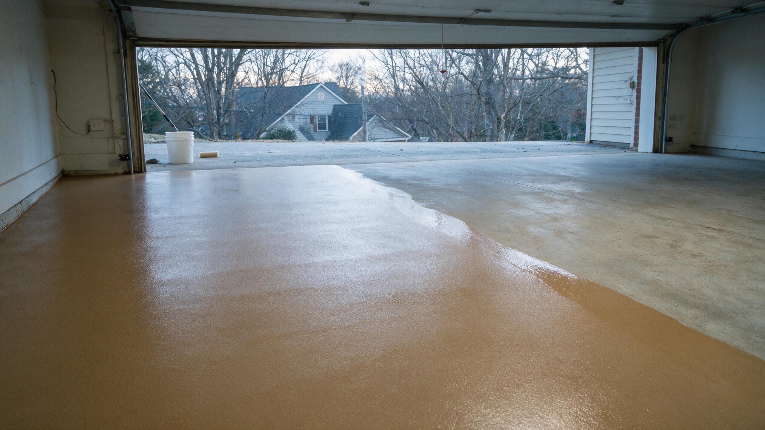 Polyaspartic garage floor coating being installed on a cold winter day in Charlotte NC