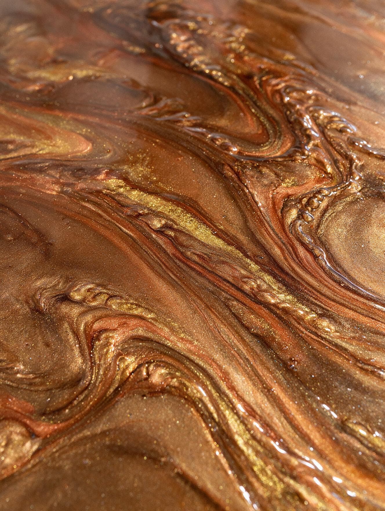 Metallic epoxy floor close-up Charlotte NC — bronze and copper swirl pattern detail